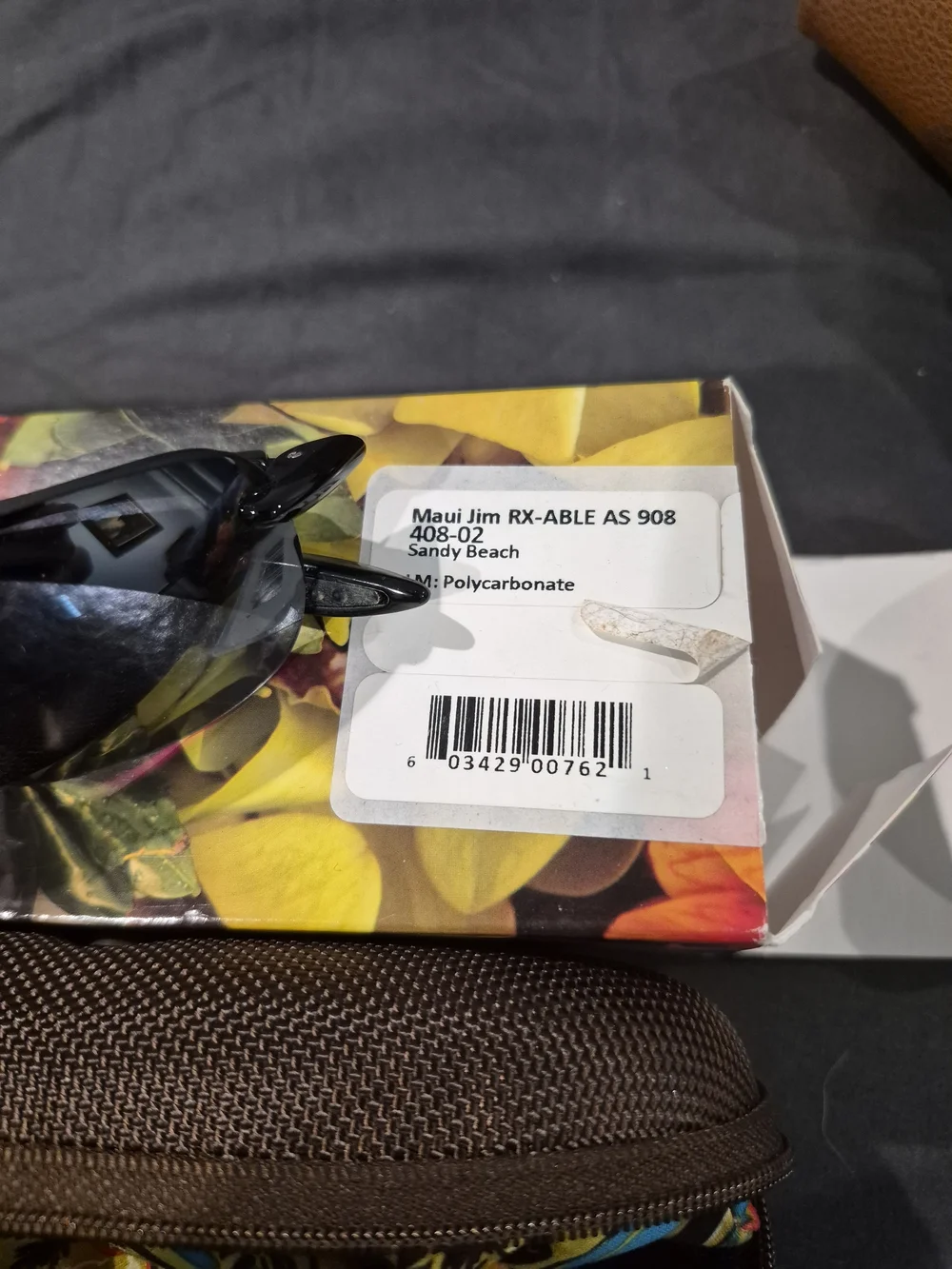 Maui Jim Polarized Rimless Sunglasses with Black Frames and Gray Lenses
